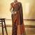Brown satin printed saree with orange border and unstiched blouse
