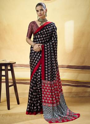 Black satin printed saree with orange border and unstiched blouse 1