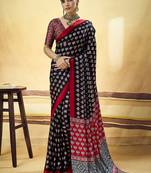 Black satin printed saree with orange border and unstiched blouse
