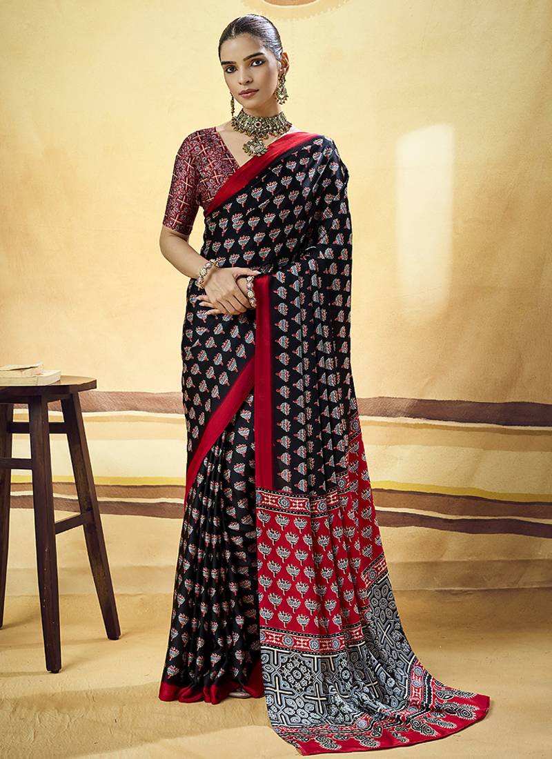 Black satin printed saree with orange border and unstiched blouse