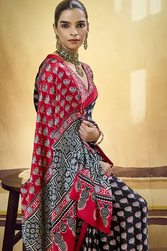 Black satin printed saree with orange border and unstiched blouse