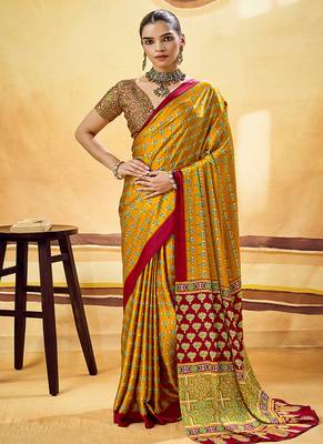 Mustard satin printed saree with orange border and unstiched blouse 1