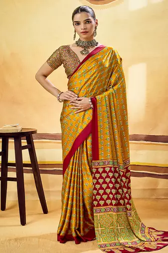 Mustard satin printed saree with orange border and unstiched blouse