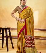 Mustard satin printed saree with orange border and unstiched blouse