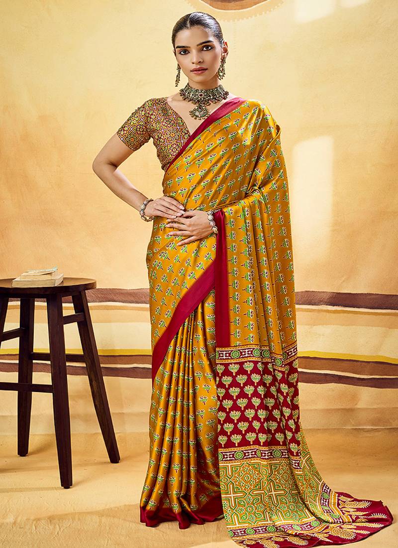 Mustard satin printed saree with orange border and unstiched blouse