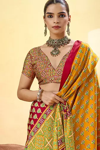 Mustard satin printed saree with orange border and unstiched blouse