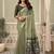 Sage green linen blend saree with woven elephant & geometric pallu