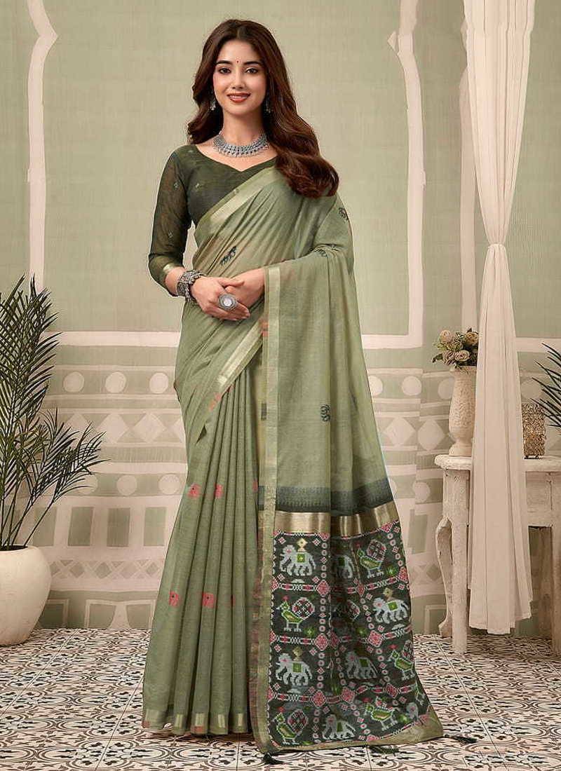 Sage green linen blend saree with woven elephant & geometric pallu