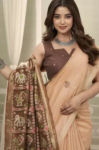 Peach linen blend saree with woven elephant & geometric pallu