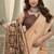 Peach linen blend saree with woven elephant & geometric pallu