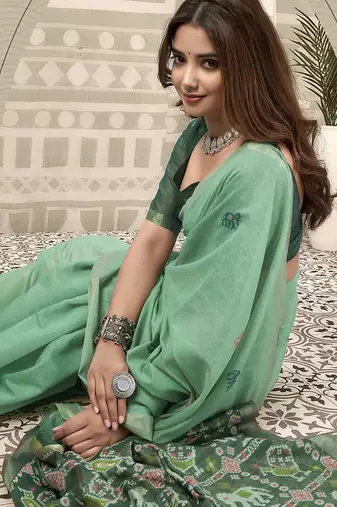 Sea green linen blend saree with woven elephant & geometric pallu