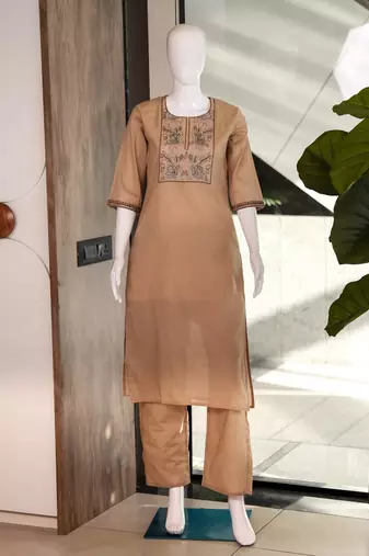 Women's new stylish trendy cream cotton silk embroidery work straight kurti with trousers