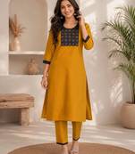 Women's new stylish mustard  cotton blend straight kurta with pants and embroidered yoke