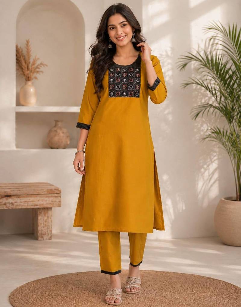 Women's new stylish mustard  cotton blend straight kurta with pants and embroidered yoke