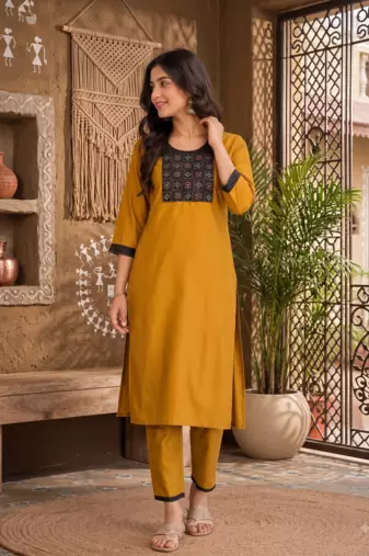 Women's new stylish mustard  cotton blend straight kurta with pants and embroidered yoke