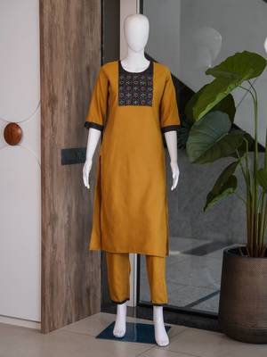 Women's new stylish mustard  cotton blend straight kurta with pants and embroidered yoke 4
