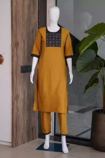 Women's new stylish mustard  cotton blend straight kurta with pants and embroidered yoke