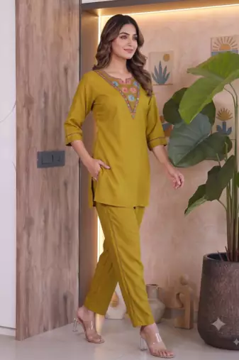 Women new mustard solid kurta pant set with heavy neck embroidery