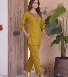 Women new mustard solid kurta pant set with heavy neck embroidery