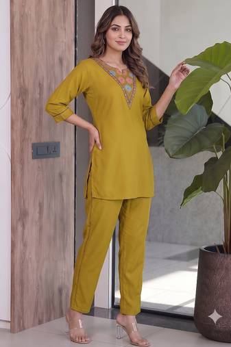 Women new mustard solid kurta pant set with heavy neck embroidery