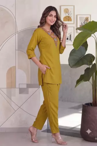 Women new mustard solid kurta pant set with heavy neck embroidery