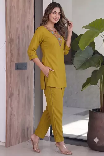 Women new mustard solid kurta pant set with heavy neck embroidery
