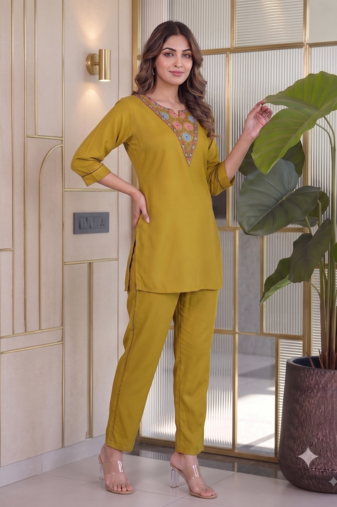 Women new mustard solid kurta pant set with heavy neck embroidery