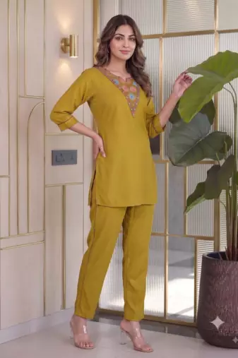 Women new mustard solid kurta pant set with heavy neck embroidery