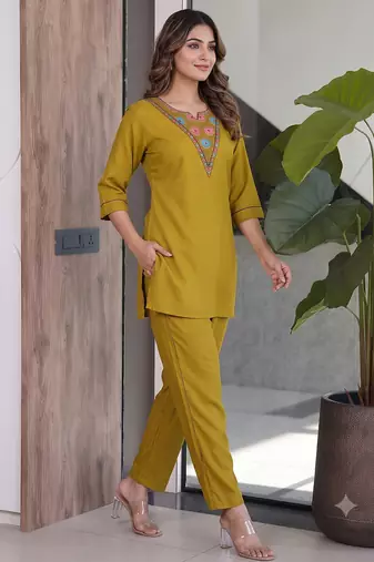 Women new mustard solid kurta pant set with heavy neck embroidery