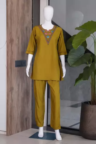 Women new mustard solid kurta pant set with heavy neck embroidery