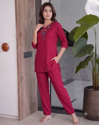 Women new rani pink solid kurta pant set with heavy neck embroidery 1