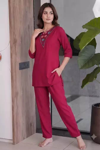 Women new rani pink solid kurta pant set with heavy neck embroidery