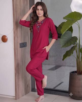 Women new rani pink solid kurta pant set with heavy neck embroidery 2