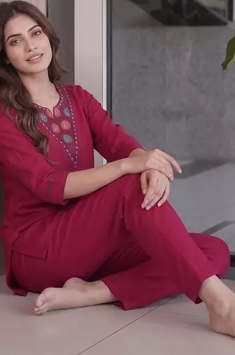 Women new rani pink solid kurta pant set with heavy neck embroidery