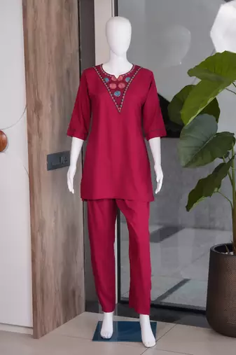 Women new rani pink solid kurta pant set with heavy neck embroidery