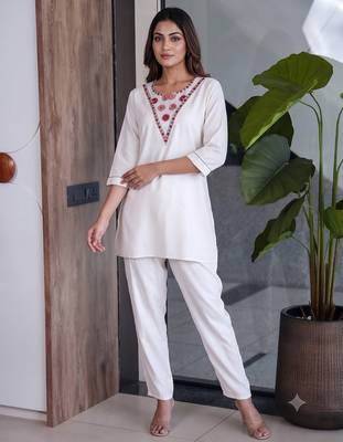 Women new white solid kurta pant set with heavy neck embroidery 1