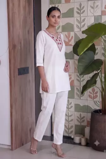 Women new white solid kurta pant set with heavy neck embroidery
