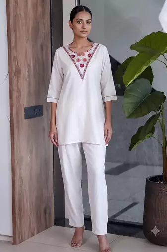 Women new white solid kurta pant set with heavy neck embroidery