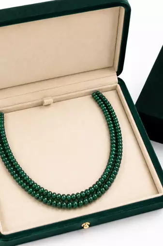 2 rows precious uncut emeralds