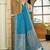 Teal blue satin silk blend woven saree with rich silver zari border