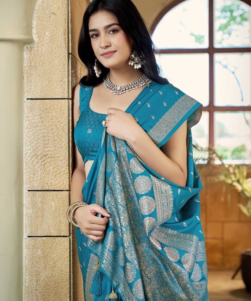 Teal blue satin silk blend woven saree with rich silver zari border