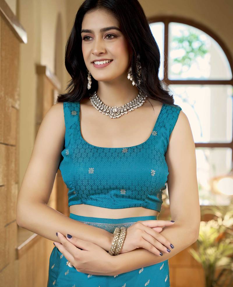 Teal blue satin silk blend woven saree with rich silver zari border