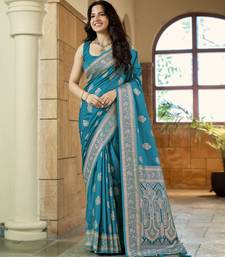 Teal blue silk blend woven saree with rich silver zari border & blouse
