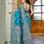 Teal blue silk blend woven saree with rich silver zari border & blouse