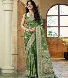 Green silk blend woven saree with rich silver zari border & blouse