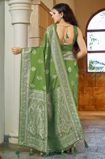 Green silk blend woven saree with rich silver zari border & blouse