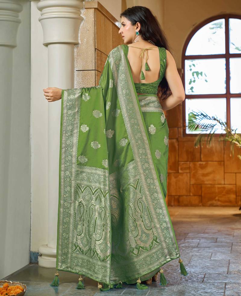 Green silk blend woven saree with rich silver zari border & blouse