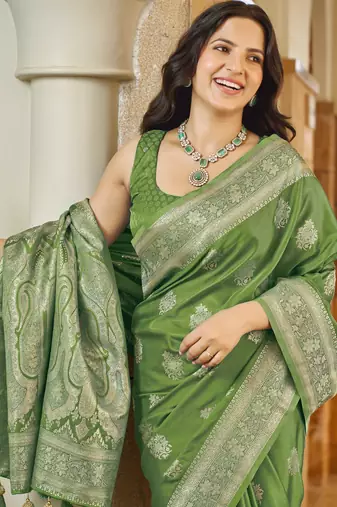 Green silk blend woven saree with rich silver zari border & blouse