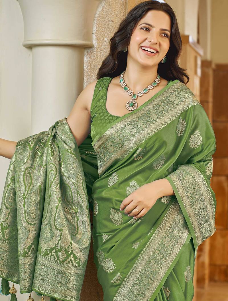 Green silk blend woven saree with rich silver zari border & blouse