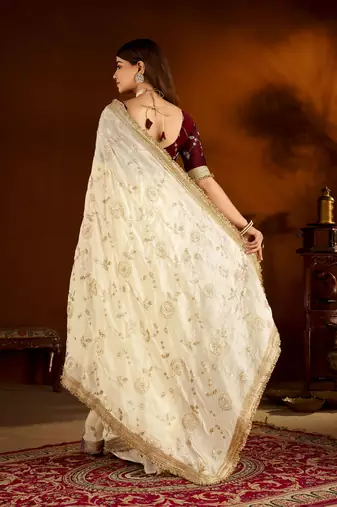 Beige color satin silk saree with maroon blouse heavy embroidered work